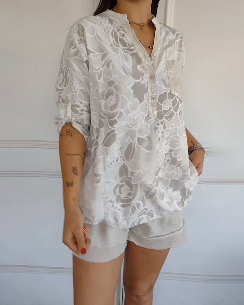 Kélya | Losse blouse met bloemenprint en pailletten