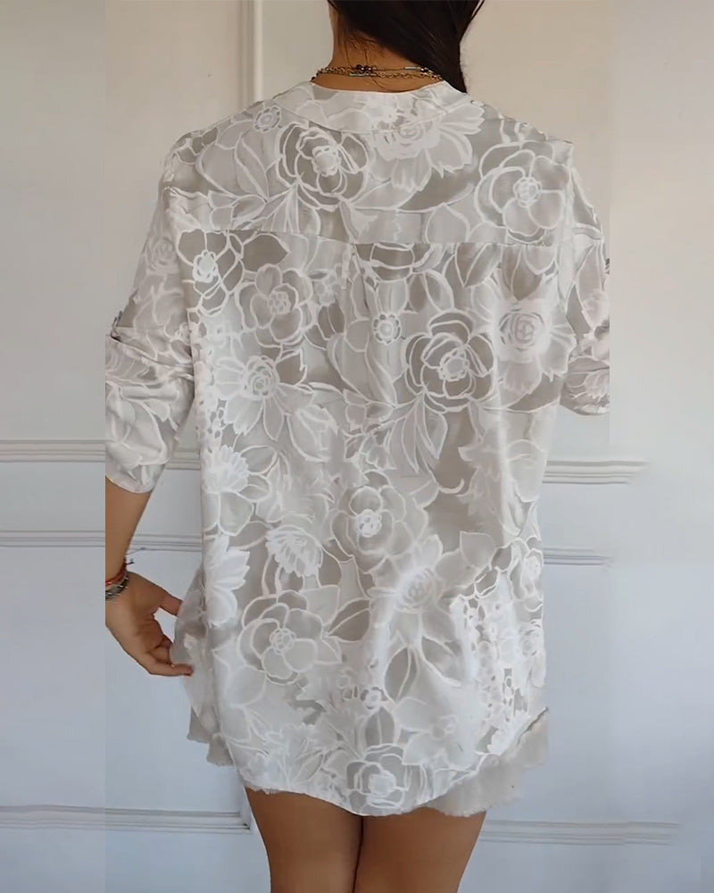 Kélya | Losse blouse met bloemenprint en pailletten