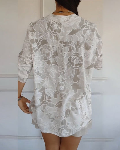 Kélya | Losse blouse met bloemenprint en pailletten