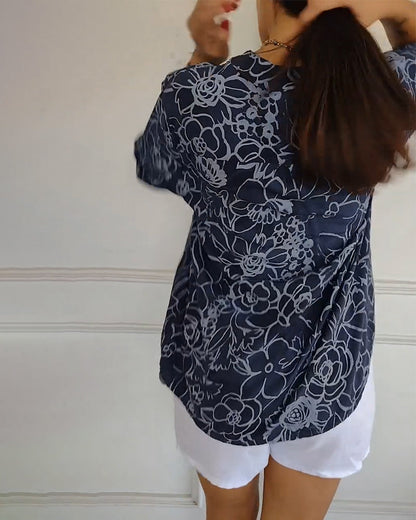 Kélya | Losse blouse met bloemenprint en pailletten