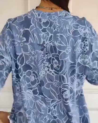 Kélya | Losse blouse met bloemenprint en pailletten